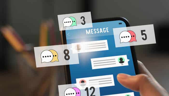 Random notification - Startup Stride - Startup Stride Smartphone displaying multiple message notification bubbles and unread chat alerts on the screen, representing high user engagement and real-time mobile notifications.