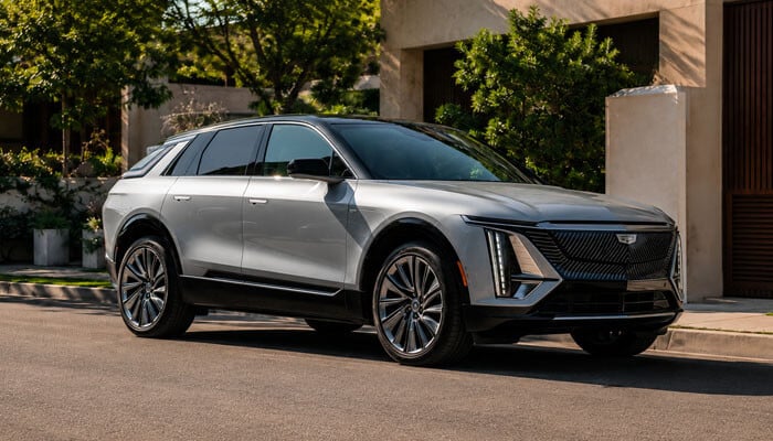 My Mode Custom Settings Can Help or Hurt Efficiency - startupstride - Startup Stride Do the driving modes in Cadillac Lyriq offer different ranges or battery usages? Silver Cadillac Lyriq electric SUV on a road.